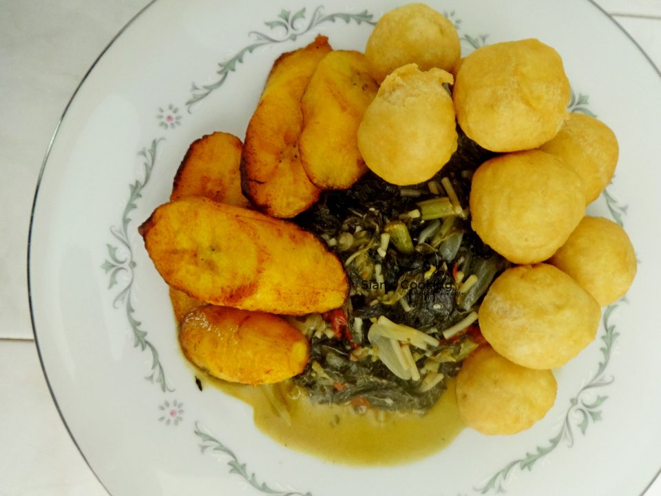 Fried Dumplings with Steamed Callaloo and fried ripe plantain