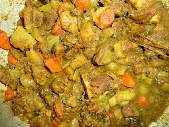 cooking curry goat