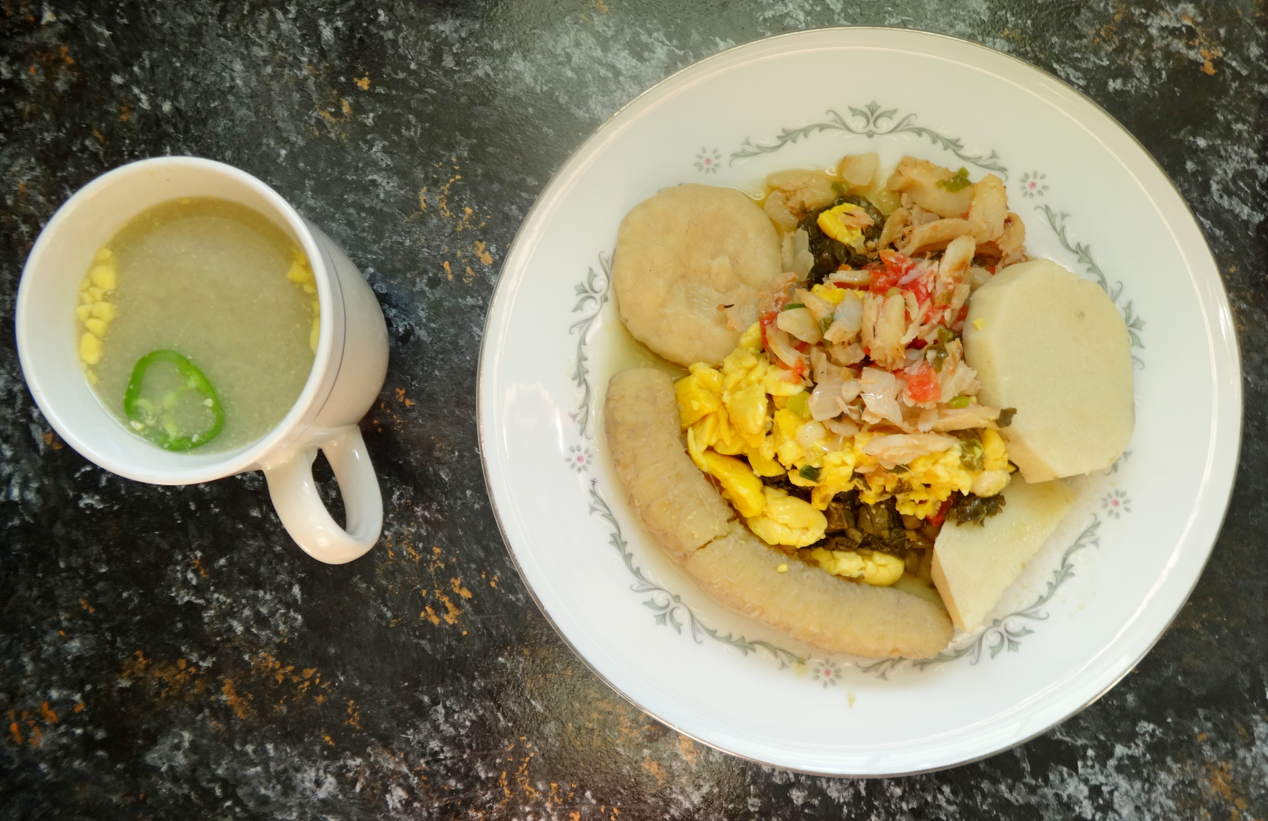 pot water alongside ackee & saltfish with food